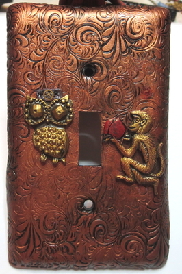 A puzzled steampunk owl being offered fruit by a monkey