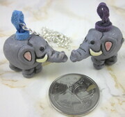 Ceramic elephant pendant with faux suede and silver-plate chain